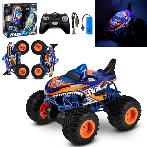 Р/у Монстр-трак Акула, перевертыш, 1:16, 4WD, 3D подсветка корпуса, гироскоп: может ездить на двух колесах, звук.эффекты, цвет голубой с оранжевым, с аккум., в/к 24*20*26 см в Джамбо Тойз