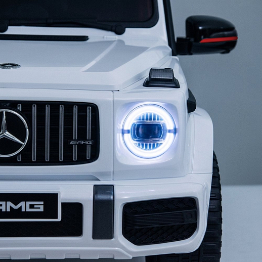 Электромобиль Mercedes Benz AMG на аккум.,12V/4.5AH*1, 380*2, Р/У 2.4GHz, свет, звук, сиденье эко-кожа, колеса EVA,откр.двери,индик.зарядки, MP3, плавн.старт, в/к 105*55*33см. Цвет - белый. в Джамбо Тойз #7