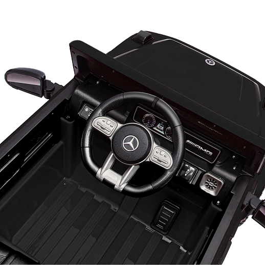 Электромобиль Mercedes Benz AMG на аккум.,12V/4.5AH*1, 380*2, Р/У 2.4GHz, свет, звук, сиденье эко-кожа, колеса EVA,откр.двери,индик.зарядки, MP3, плавн.старт, в/к 105*55*33см. Цвет - черный. в Джамбо Тойз #4