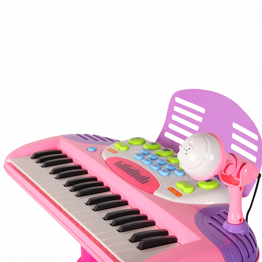 Детское электронное пианино на бат., в компл. микрофон, стул, свет. звук. эффект, цвет розовый, в/к 60*43*12 см  в Джамбо Тойз #6